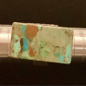 Turquoise, sterling, silver ring, marked .925 a unique design & a beautiful band
